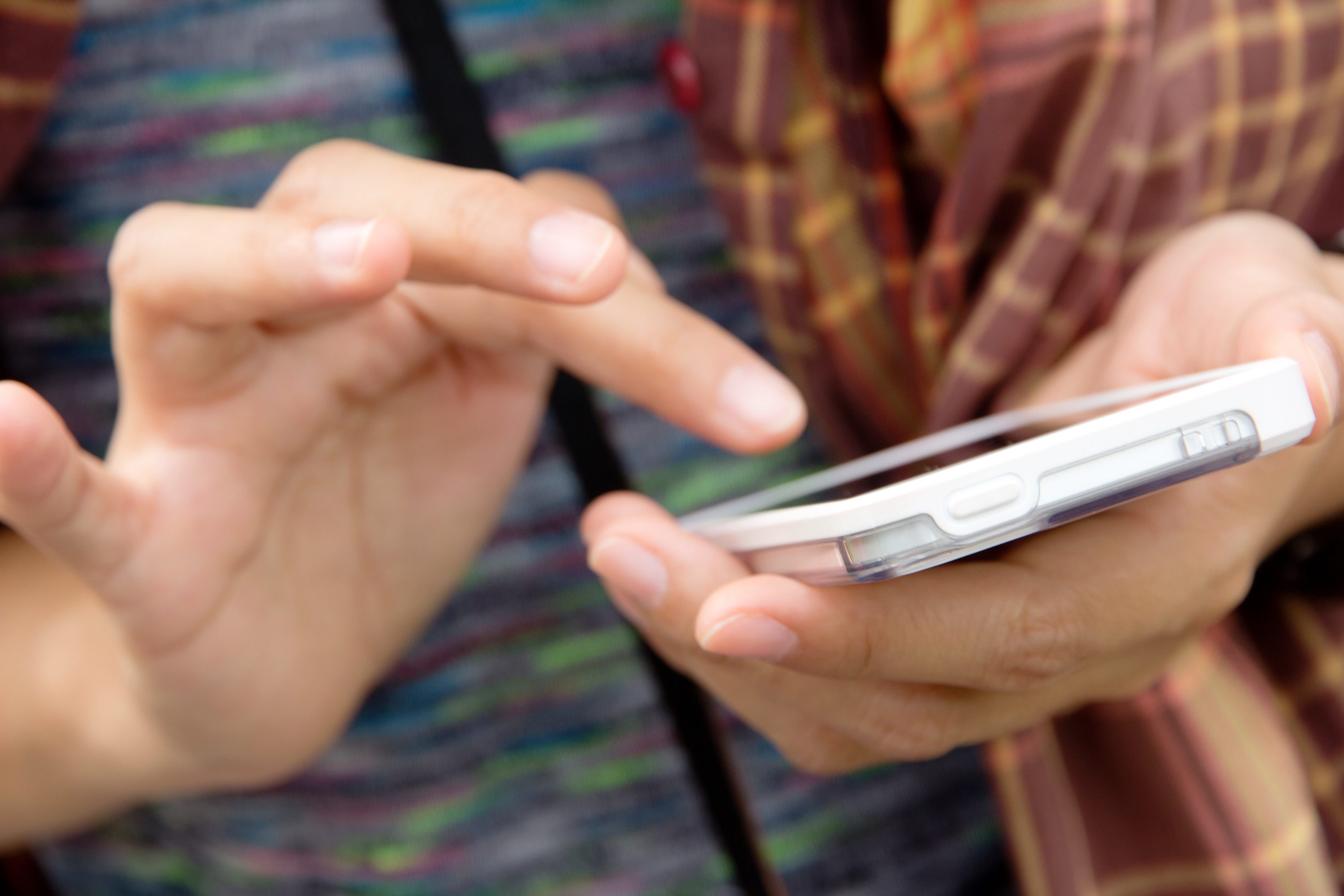 Teenage girl text messaging on her phone Texts you should ignore