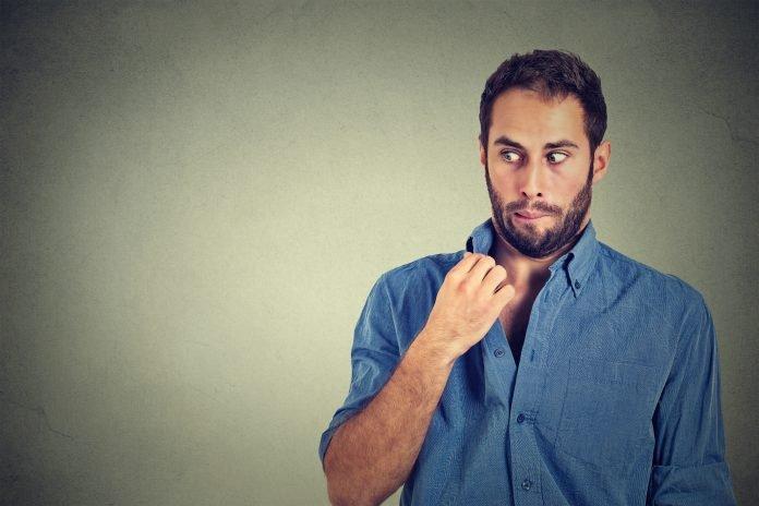 man opening shirt to vent hot unpleasant awkward situation blackmail!