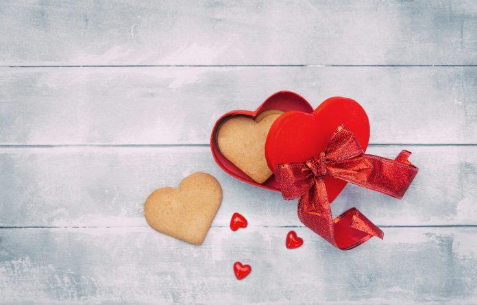 Open heart box with cookies. Valentines day background Valentine's Day Scam