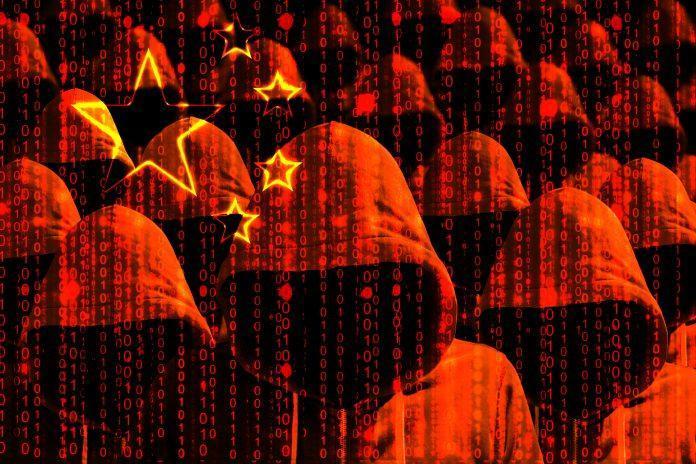 Group of hooded hackers shining through a digital chinese flag Chinese hackers