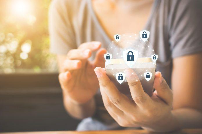 Data protection and security important information in your mobile phone, Woman hand using smartphone and icon key on shield Apple privacy