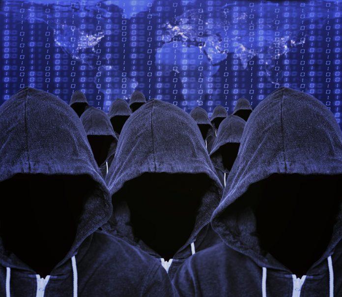 Hooded Computer Hackers with Global Internet Map and Binary Code Stuxnet