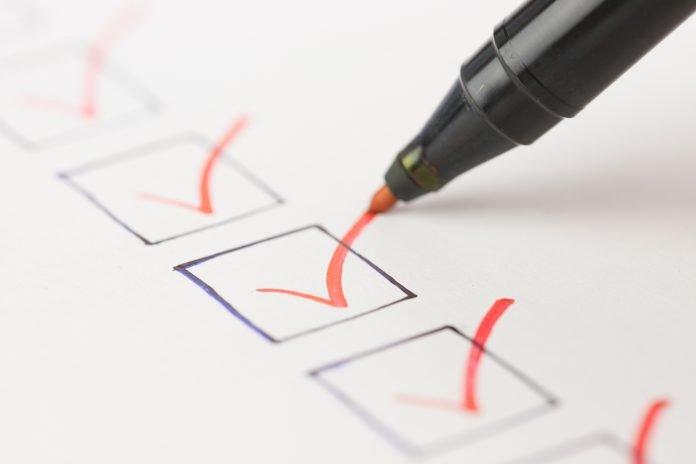 Macro photography of check mark over white background Election